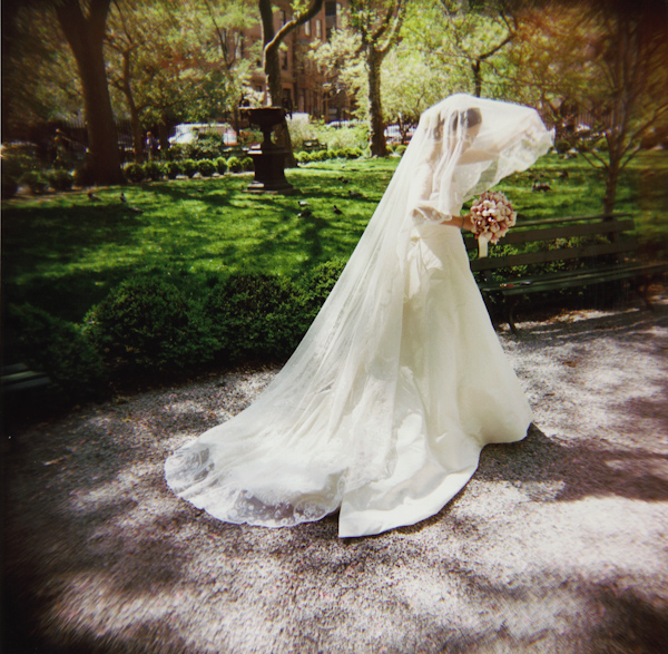 photo by New York City based wedding photographer Karen Hill - beautiful bride in white full length veil in park 